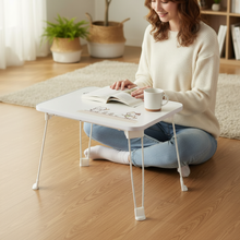  Woman Legs Extended Under Cat Table Close-up
